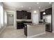Modern kitchen with dark wood cabinets, granite countertops, and stainless steel appliances, designed for functionality and style at 4146 Bexley Village Dr, Land O Lakes, FL 34638