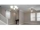 Bright living room featuring a ceiling fan, and a staircase, creating a welcoming space for relaxation and entertainment at 4146 Bexley Village Dr, Land O Lakes, FL 34638