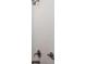 Shower with white tile and bronze shower head and handles at 4146 Bexley Village Dr, Land O Lakes, FL 34638