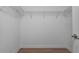Walk in closet with wire shelving and wood floor at 4146 Bexley Village Dr, Land O Lakes, FL 34638