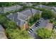 Aerial view of colorful apartment buildings surrounded by lush green landscaping and parking area at 4207 S Dale Mabry Hwy # 8304, Tampa, FL 33611