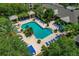 Aerial view of community pool, lounge chairs, gazebos, and lush tropical landscaping at 4207 S Dale Mabry Hwy # 8304, Tampa, FL 33611