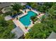 Aerial view of pool area surrounded by lush tropical landscaping, lounge chairs and gazebos at 4207 S Dale Mabry Hwy # 8304, Tampa, FL 33611