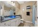 Bathroom with a blue vessel sink, white cabinets, and granite countertops at 4207 S Dale Mabry Hwy # 8304, Tampa, FL 33611