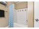 A clean white bathtub and shower combination with tiled walls and neutral accents at 4207 S Dale Mabry Hwy # 8304, Tampa, FL 33611