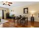 Bright dining room area with hardwood floors, a ceiling fan, modern furniture, and natural light at 4207 S Dale Mabry Hwy # 8304, Tampa, FL 33611