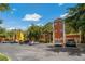 Exterior view of multi-story condominium building with lush landscaping and parking at 4207 S Dale Mabry Hwy # 8304, Tampa, FL 33611