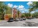 Multi-story condominium building with reserved parking and lush landscaping at 4207 S Dale Mabry Hwy # 8304, Tampa, FL 33611