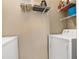 Well-equipped laundry room featuring shelving units and side-by-side washer and dryer for household tasks at 4207 S Dale Mabry Hwy # 8304, Tampa, FL 33611