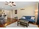 Inviting living room features hardwood floors, a ceiling fan, and comfortable seating for relaxing or entertaining at 4207 S Dale Mabry Hwy # 8304, Tampa, FL 33611