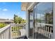 A cozy balcony overlooks the neighborhood at 428 Klosterman W Rd, Palm Harbor, FL 34683