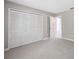 An airy bedroom featuring neutral colors and large closets at 428 Klosterman W Rd, Palm Harbor, FL 34683