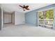 Spacious bedroom includes large closets, access to a private balcony and neutral carpet at 428 Klosterman W Rd, Palm Harbor, FL 34683