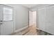 A bright bedroom with hardwood floors, closet, and natural light at 428 Klosterman W Rd, Palm Harbor, FL 34683