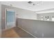 Hallway with access to a bedroom on the left and windows on the right at 428 Klosterman W Rd, Palm Harbor, FL 34683