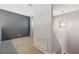 Hallway with gray walls, neutral carpet and a modern chandelier at 428 Klosterman W Rd, Palm Harbor, FL 34683