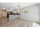 Eat-in kitchen with stainless steel appliances, a stylish light fixture, and a breakfast bar at 428 Klosterman W Rd, Palm Harbor, FL 34683
