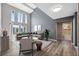 Open living room with large windows, vaulted ceiling, and modern furnishings at 428 Klosterman W Rd, Palm Harbor, FL 34683