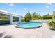 A backyard swimming pool with a deck at 428 Klosterman W Rd, Palm Harbor, FL 34683