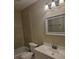 Clean bathroom featuring a vanity with storage, a mirror, and a tiled shower/tub combo at 474 Hinton St, Port Charlotte, FL 33954