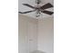 Bedroom showcasing a ceiling fan, a neutral color palette, and a closet for storage at 474 Hinton St, Port Charlotte, FL 33954
