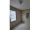 Bedroom with tile floors and large window at 474 Hinton St, Port Charlotte, FL 33954