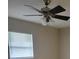 Bedroom featuring a ceiling fan, neutral color palette, and a window for natural light at 474 Hinton St, Port Charlotte, FL 33954