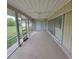 Large screened-in patio with ceiling fans at 474 Hinton St, Port Charlotte, FL 33954