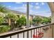 Balcony view of tropical landscaping and neighborhood street at 504 S Armenia Ave # 1329B, Tampa, FL 33609