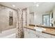 Updated bathroom featuring a granite countertop, decorative backsplash, and modern shower-tub combo at 504 S Armenia Ave # 1329B, Tampa, FL 33609