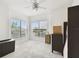 Bright bedroom with large windows, neutral carpet, and ceiling fan offering natural light at 504 S Armenia Ave # 1329B, Tampa, FL 33609