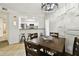 Cozy dining room features an open kitchen, modern lighting, and stylish decor at 504 S Armenia Ave # 1329B, Tampa, FL 33609