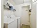 Laundry room featuring a modern washer and dryer along with overhead storage at 504 S Armenia Ave # 1329B, Tampa, FL 33609
