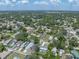 Wide aerial view of a suburban neighborhood with lush trees and blue skies on a sunny day at 5044 17Th N St, St Petersburg, FL 33714