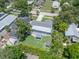 Aerial shot of a well-kept home with a spacious backyard; complete with a gazebo and storage shed, surrounded by greenery at 5044 17Th N St, St Petersburg, FL 33714