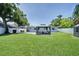 Large backyard featuring a gazebo and green lawn; perfect for outdoor relaxation, entertaining, and enjoying the outdoors at 5044 17Th N St, St Petersburg, FL 33714