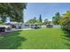 Spacious backyard featuring a gazebo, lush lawn, and patio area, perfect for outdoor living and entertaining guests at 5044 17Th N St, St Petersburg, FL 33714