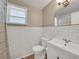 Bright bathroom features white subway tile, updated fixtures, and natural light for a clean, fresh feel at 5044 17Th N St, St Petersburg, FL 33714