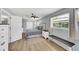 Comfortable bedroom with light wood floors, neutral wall colors, and a window providing ample natural light at 5044 17Th N St, St Petersburg, FL 33714