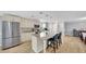 Bright kitchen features stainless steel appliances, a marble island with seating, and modern pendant lighting at 5044 17Th N St, St Petersburg, FL 33714