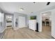 Spacious main bedroom with light wood floors connecting to an ensuite bathroom and closet space at 5044 17Th N St, St Petersburg, FL 33714