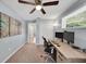 The bright home office has natural light, a ceiling fan, and stylish décor for work and leisure at 5044 17Th N St, St Petersburg, FL 33714