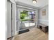 Cozy sunroom with a sliding glass door leading to a stone patio and a serene backyard oasis at 5044 17Th N St, St Petersburg, FL 33714