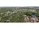 Birds eye view showcases the neighborhood's pools, lakes, and mature trees at 506 Duxbury Ct # A, Safety Harbor, FL 34695