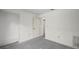 A bedroom featuring a doorway to another room and a large closet at 506 Duxbury Ct # A, Safety Harbor, FL 34695