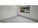 A bright bedroom with a large window offering outdoor views at 506 Duxbury Ct # A, Safety Harbor, FL 34695