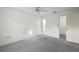 White bedroom with a ceiling fan and doorways to other rooms at 506 Duxbury Ct # A, Safety Harbor, FL 34695