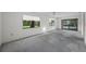 View of the living room with natural light and a ceiling fan at 506 Duxbury Ct # A, Safety Harbor, FL 34695