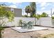 Private backyard featuring a white fence, pea gravel, and an outdoor dining space at 5221 4Th N Ave, St Petersburg, FL 33710