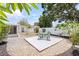 Private backyard with a white fence, pea gravel, and a patio with outdoor seating at 5221 4Th N Ave, St Petersburg, FL 33710